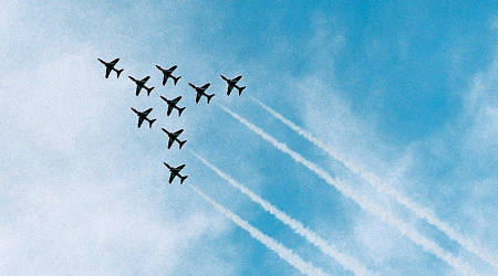 Nine Jets Flying in a Jet Shaped Formation