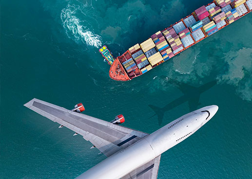 An overhead shot of a plane and a cargo ship