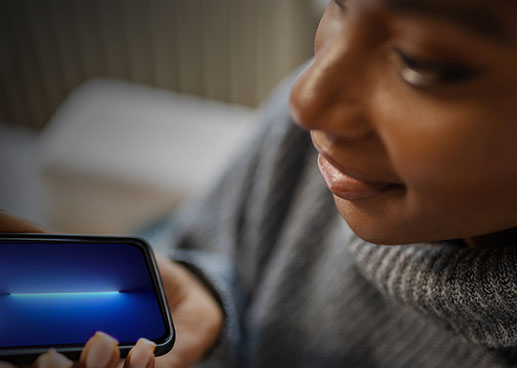 Person speaking into a smartphone