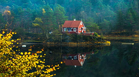 House on lake in autumn