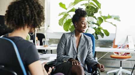 a group of women discussing science and technology