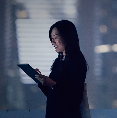 woman holding tablet