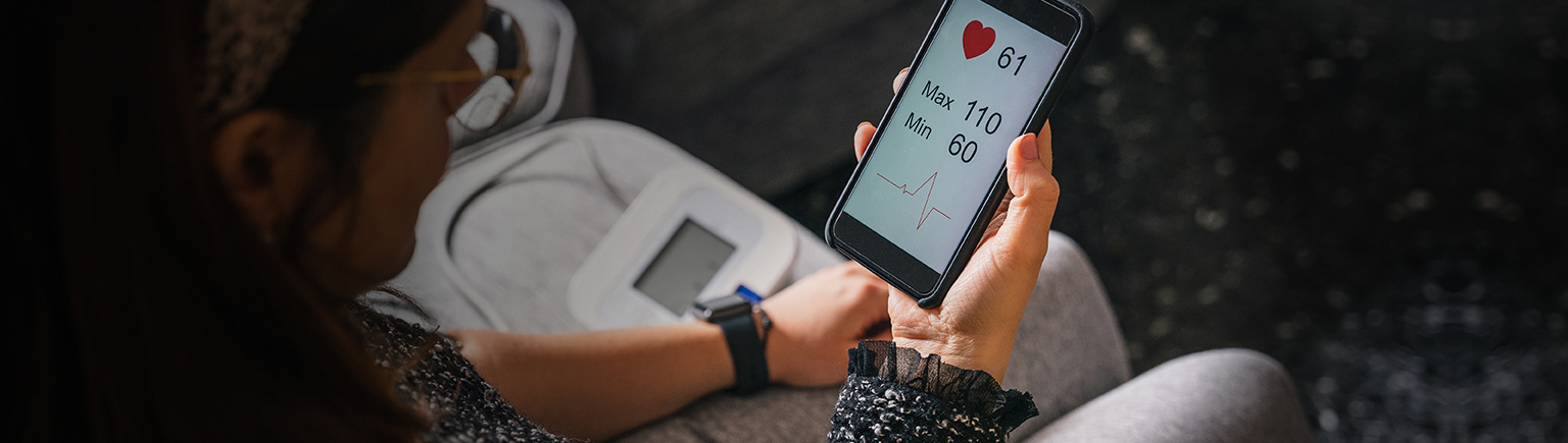 woman monitoring here blood pressure in an App