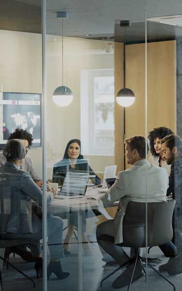 Business Colleagues Discussing Strategy At Office