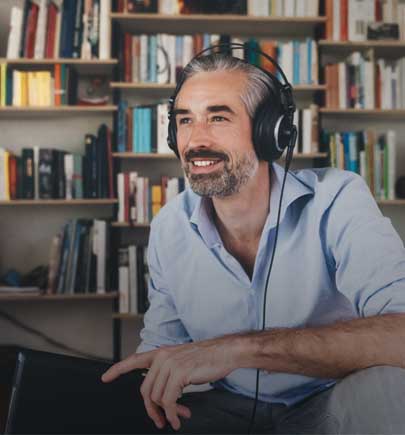 man smiling wearing headphones 
