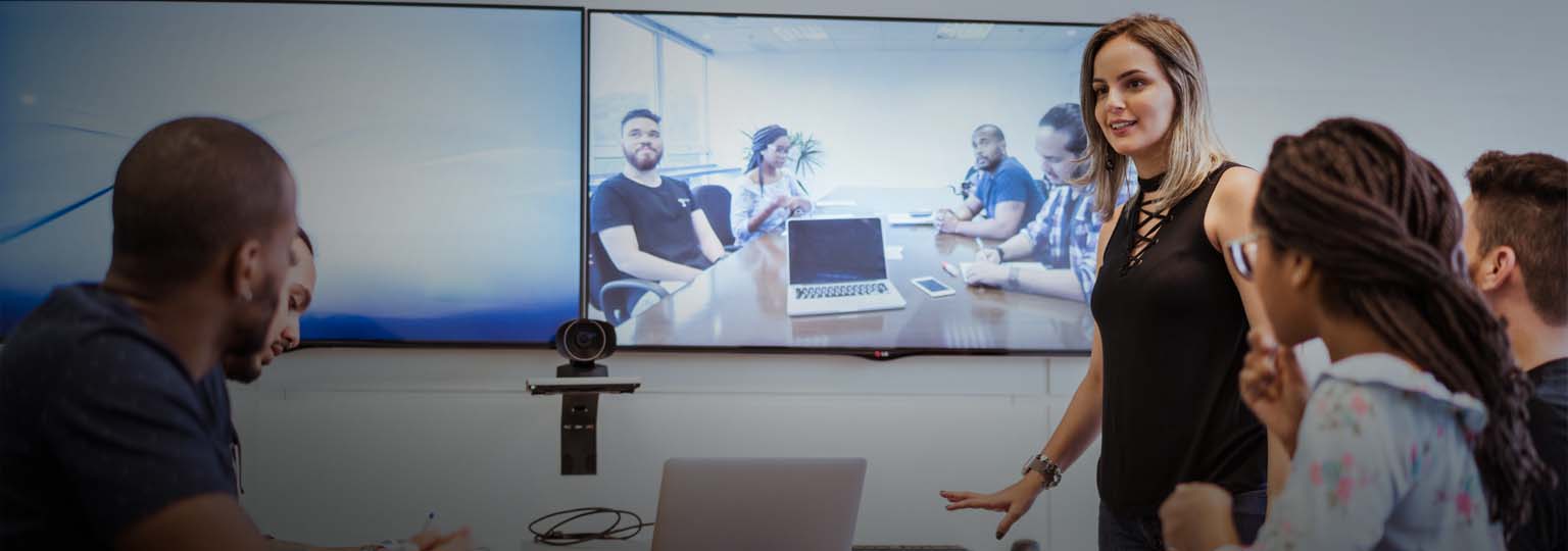 colleagues discussing during video conference in meeting room