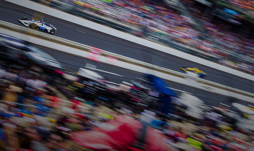 racing image of cars on track