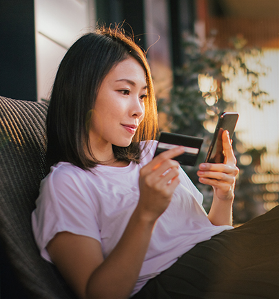 Woman using credit card payment via mobile