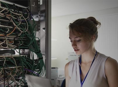 Female employee in data center